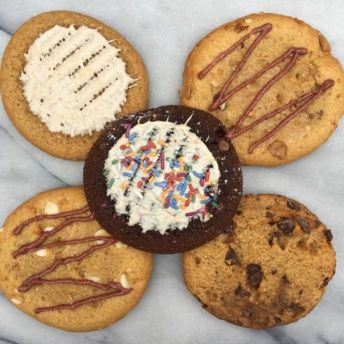 Gluten-free protein cookies drizzled with nut butter from Buff Bake